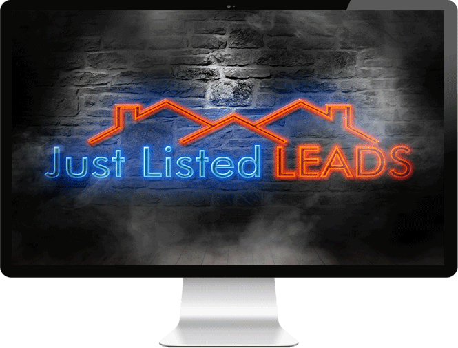 Image of computer monitor with Just Listed LEADS logo displayed as a flashing neon sign on brick wall